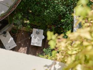 an overhead view of a wooden deck with plants at Beausejour Ranelagh in Paris