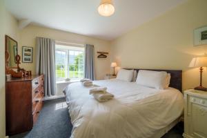 Voodi või voodid majutusasutuse 3 Gowbarrow Cottages toas