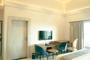 Televiisor ja/või meelelahutuskeskus majutusasutuses Ariena by Spree Hotels Goa