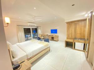 Voodi või voodid majutusasutuse Ariena by Spree Hotels Goa toas