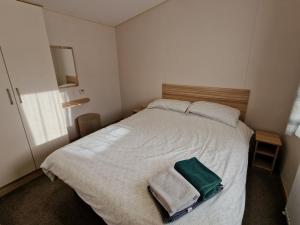 Ένα ή περισσότερα κρεβάτια σε δωμάτιο στο Summer Breeze 2