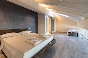 Posteľ alebo postele v izbe v ubytovaní Inn Aosta Apartments