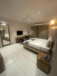 Voodi või voodid majutusasutuse Ariena by Spree Hotels Goa toas