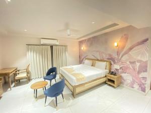 Voodi või voodid majutusasutuse Ariena by Spree Hotels Goa toas