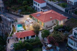 an aerial view of a house with a red roof at Islander - Funchal Seaside Villas in Funchal