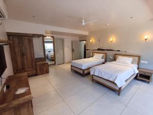 Voodi või voodid majutusasutuse Ariena by Spree Hotels Goa toas
