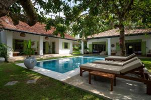 a pool in the backyard of a house at Zen Villa in Ahangama