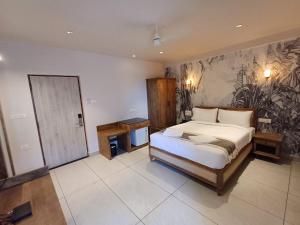 Voodi või voodid majutusasutuse Ariena by Spree Hotels Goa toas
