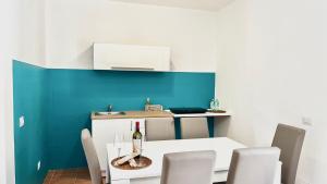 a dining room with a white table and chairs at SambaSS Apartment in Roccamonfina