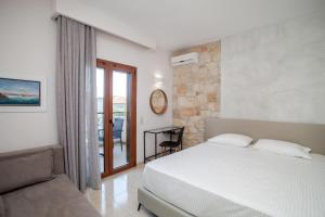 Postel nebo postele na pokoji v ubytování Venia Apartments