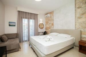Postel nebo postele na pokoji v ubytování Venia Apartments + 14 fotografií