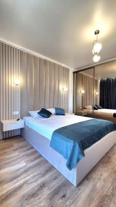 En eller flere senge i et værelse på The Great Sofi Residence A6