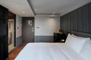 Letto o letti in una camera di Reddot Hotel