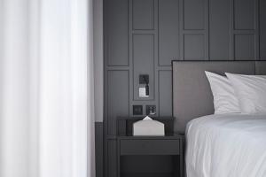 Letto o letti in una camera di Reddot Hotel