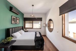 a bedroom with a large bed and a mirror at SunnyVillas-3BR New Modern Villa-Private Pool-HVN in Paralimni +39 photos