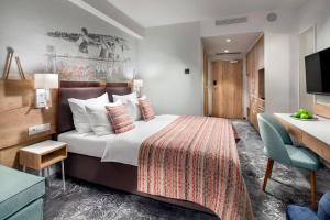 Postel nebo postele na pokoji v ubytování Hotel Aquarion Family & Friends - Destigo Hotels + 39 fotografií