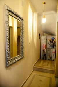 a hallway with a mirror on the wall at Preveza Palazzo in Preveza