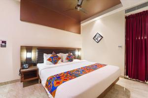 Postel nebo postele na pokoji v ubytování FabHotel Prime Nestlay Rooms Ramnad - Nr Golden Shopping Mall + 37 fotografií