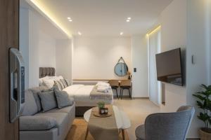 A bed or beds in a room at Heart Of Athens Apartments