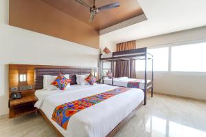 Postel nebo postele na pokoji v ubytování FabHotel Prime Nestlay Rooms Ramnad - Nr Golden Shopping Mall