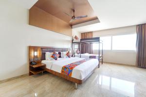Postel nebo postele na pokoji v ubytování FabHotel Prime Nestlay Rooms Ramnad - Nr Golden Shopping Mall