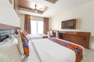 Postel nebo postele na pokoji v ubytování FabHotel Prime Nestlay Rooms Ramnad - Nr Golden Shopping Mall