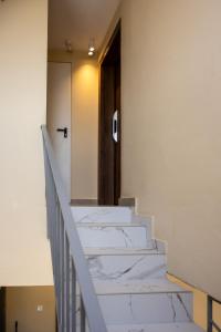 A bed or beds in a room at Heart Of Athens Apartments