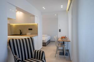A bed or beds in a room at Heart Of Athens Apartments