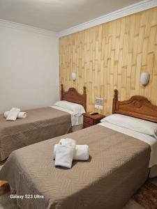 Postel nebo postele na pokoji v ubytování Hotel Virgen de los Reyes