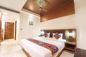 Postel nebo postele na pokoji v ubytování FabHotel Prime Nestlay Rooms Ramnad - Nr Golden Shopping Mall