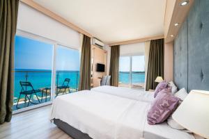 Кровать или кровати в номере Manolya Hotel