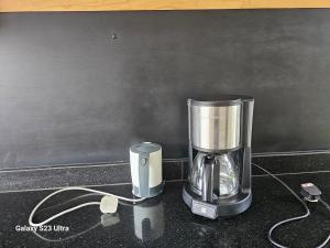 Sadržaji za pripremu kafe i čaja u objektu Muguet by the Ibiscot