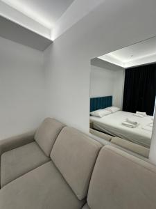 Postel nebo postele na pokoji v ubytování IO's Apartments