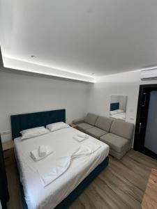 Postel nebo postele na pokoji v ubytování IO's Apartments
