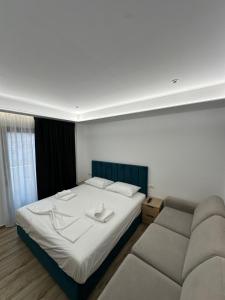 Postel nebo postele na pokoji v ubytování IO's Apartments