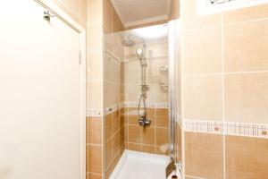 a bathroom with a shower and a bath tub at Qbra House 2BR Central Apt Walk to Landmarks in Istanbul +20 photos