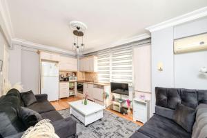 a living room with a couch and a table at Qbra House 2BR Central Apt Walk to Landmarks in Istanbul
