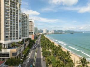 a view of the beach and buildings and the ocean at Havana Nha Trang Hotel in Nha Trang
