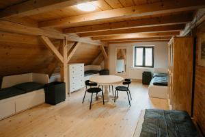 a room with a bed and a table and chairs at Kousek ráje in Třinec