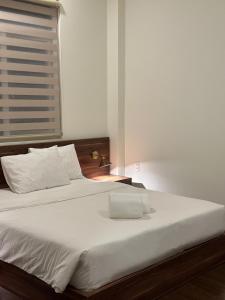 Letto o letti in una camera di Hong Nhan Hotel