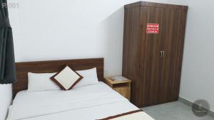 Postel nebo postele na pokoji v ubytování Vy An Hotel