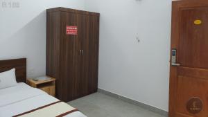 Postel nebo postele na pokoji v ubytování Vy An Hotel