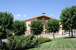 a building with trees in front of it at Acogedor apartamento en pleno centro in Puigcerdà