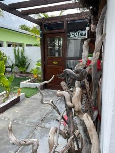 a pile of antlers sitting outside of a building at Himeyn Beach Inn - Ocho Homes by Eight Continents in Hanimaadhoo