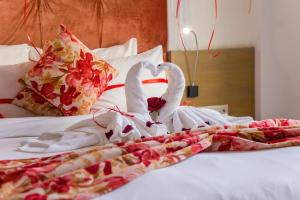 Uma cama ou camas num quarto em Mandarin Palace Hotel & Spa