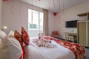 Uma cama ou camas num quarto em Mandarin Palace Hotel & Spa
