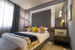 Uma cama ou camas num quarto em Mandarin Palace Hotel & Spa