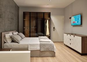 Postel nebo postele na pokoji v ubytování Montflux Hotel