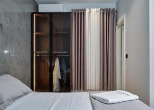 Postel nebo postele na pokoji v ubytování Montflux Hotel