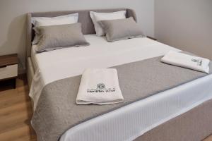Postel nebo postele na pokoji v ubytování Montflux Hotel